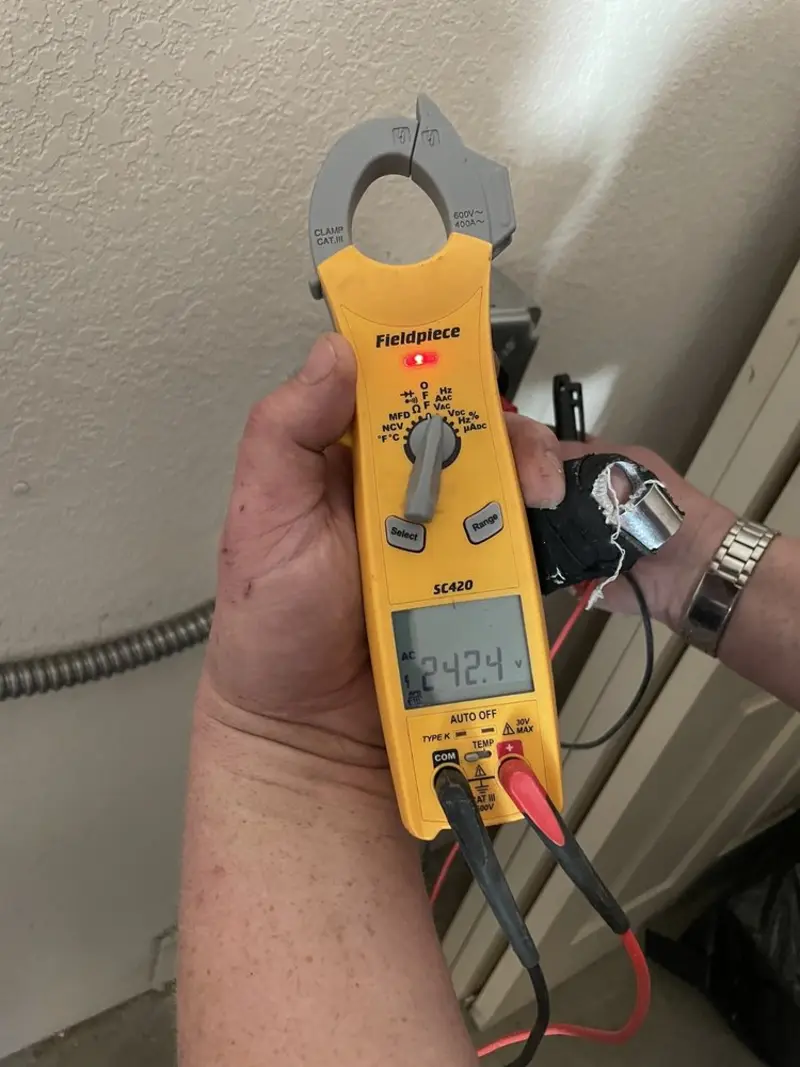 Voltage testing with clamp meter during Aluminum Wiring Replacement in Mill Creek East